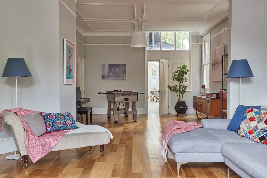 a living room filled with furniture and a large window