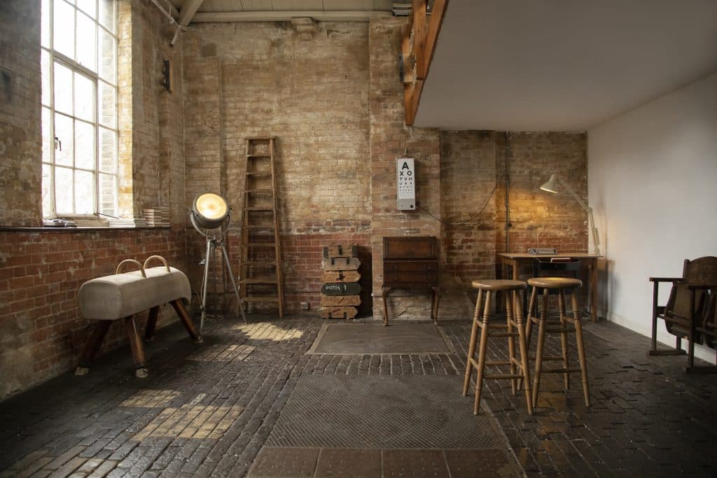a room filled with furniture and a fireplace