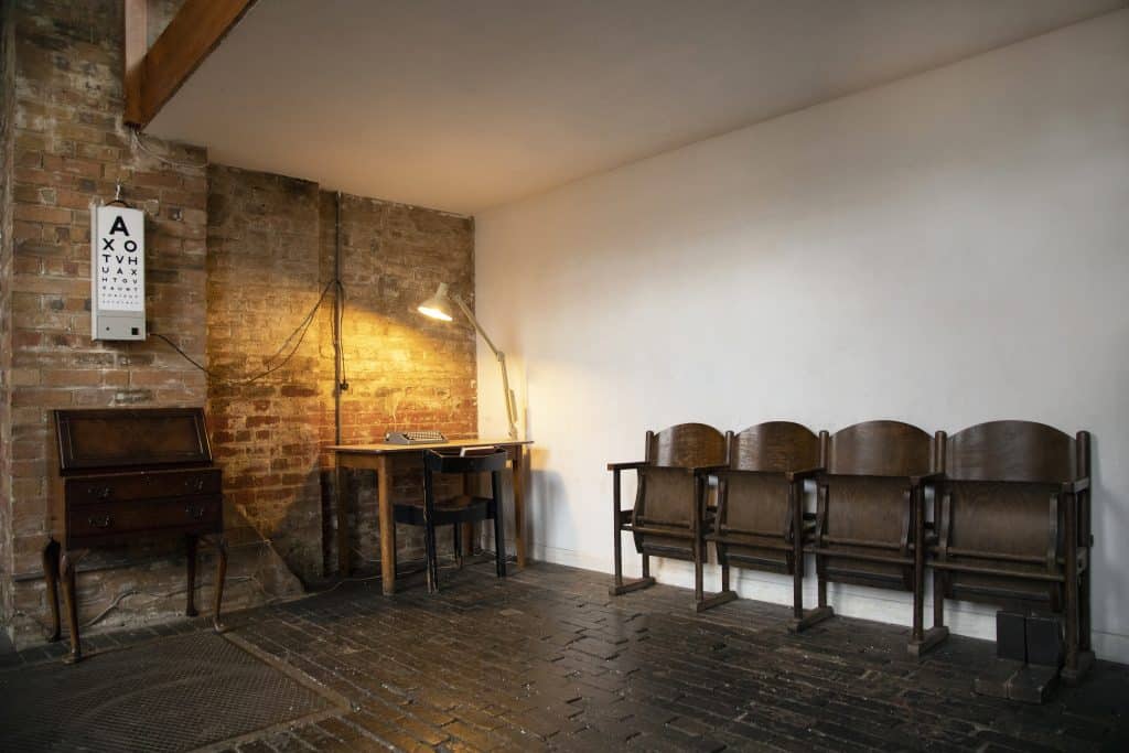 a room filled with furniture and a fireplace