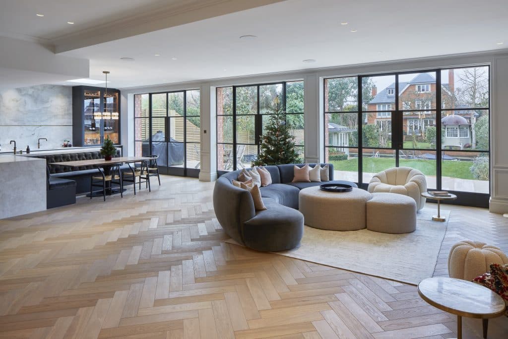 a living room filled with furniture and a large window