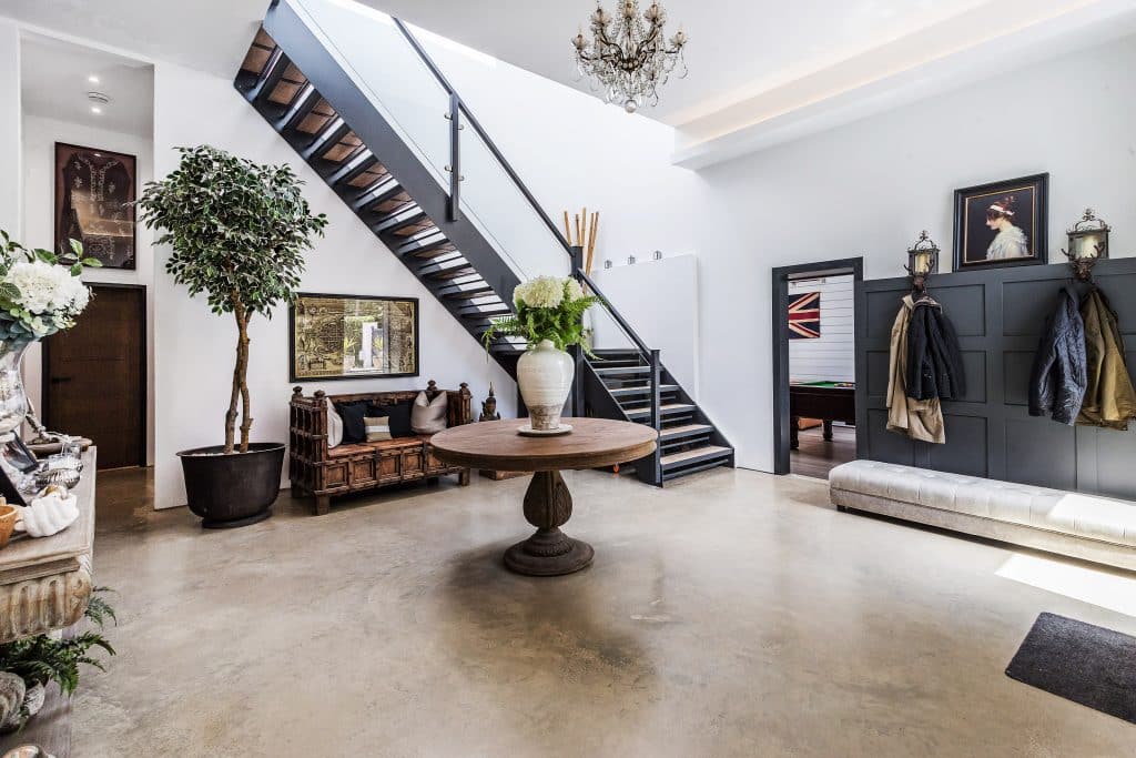 a living room filled with furniture and a fireplace
