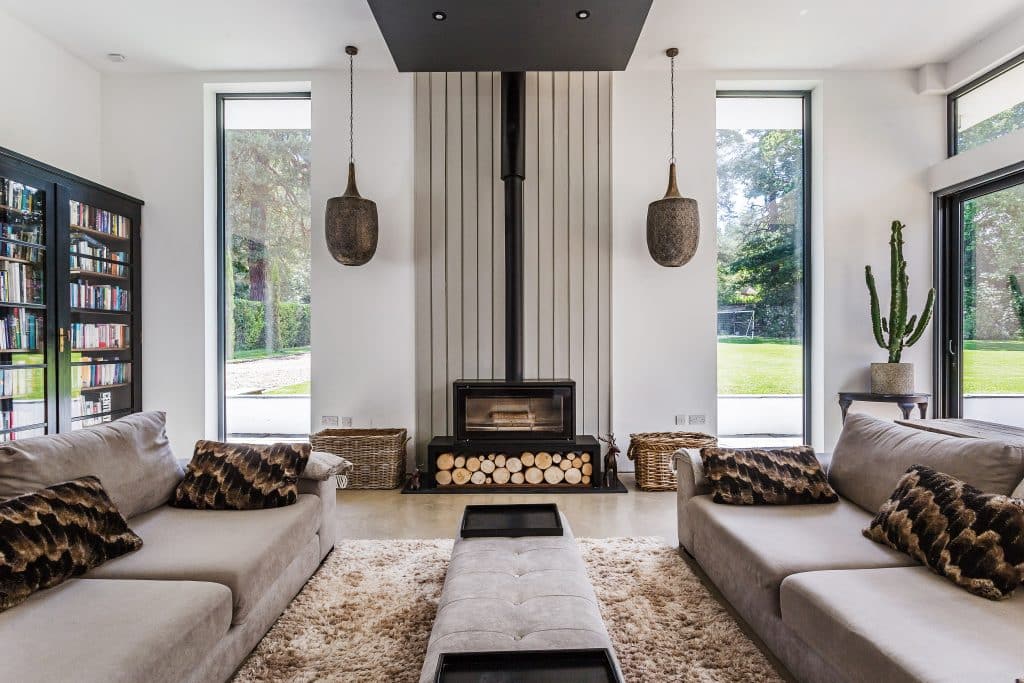 a living room filled with furniture and a fire place