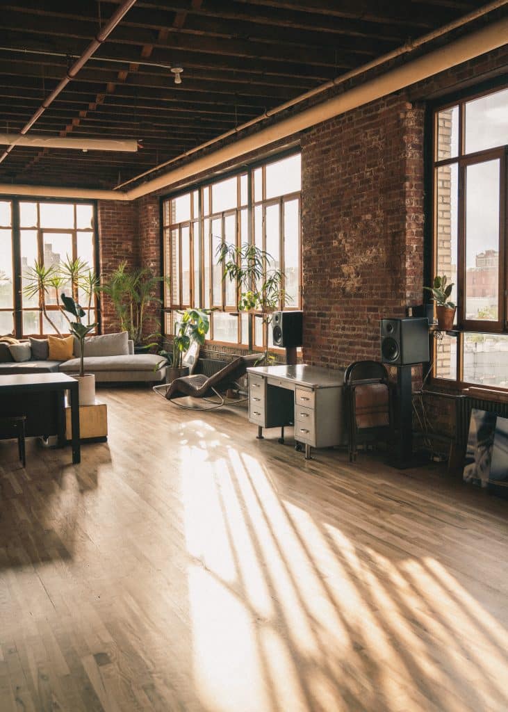 a room filled with furniture and a brick building