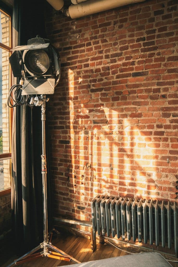 a fireplace in front of a brick building