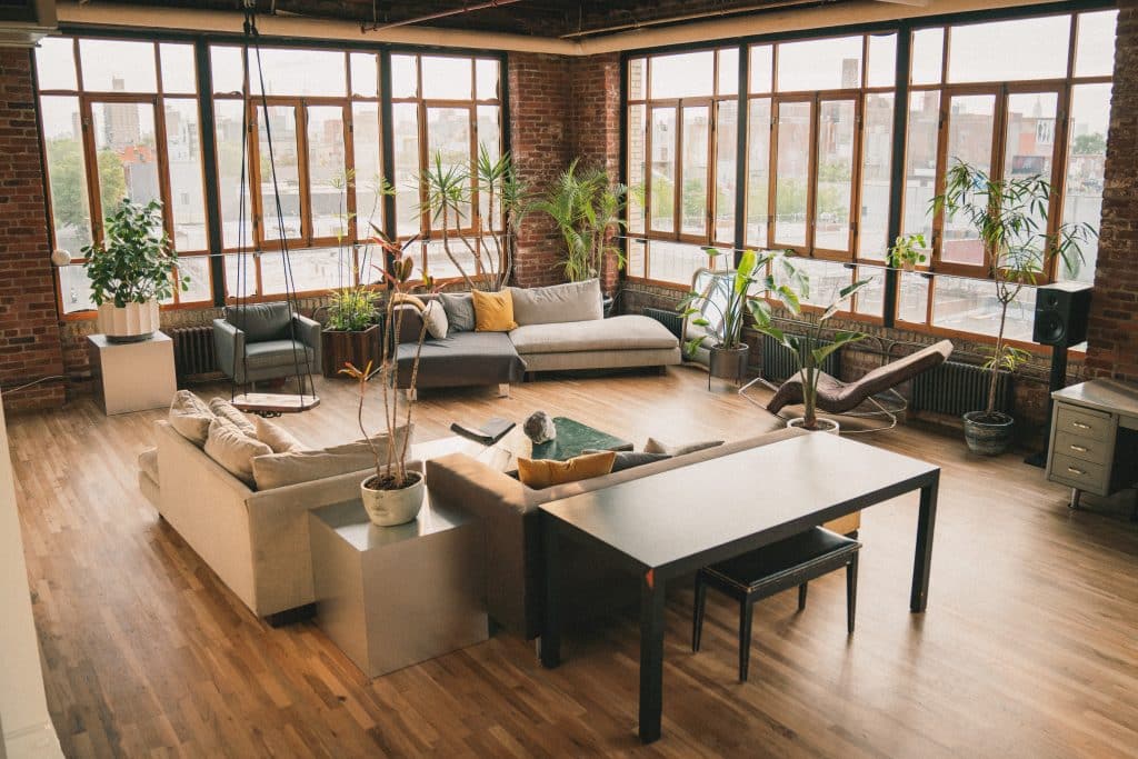 a living room filled with furniture and a large window