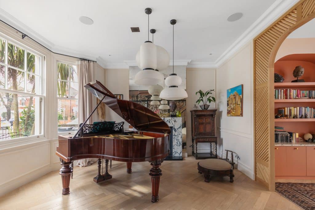a living room filled with furniture and a large window