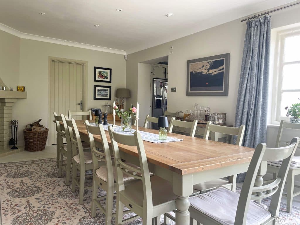 PARK LODGE Dining-room-oak-table-paintings-windows-wine-rack-fireplace-cabinet-carpet-TV-filming-location-hire-lodge-London