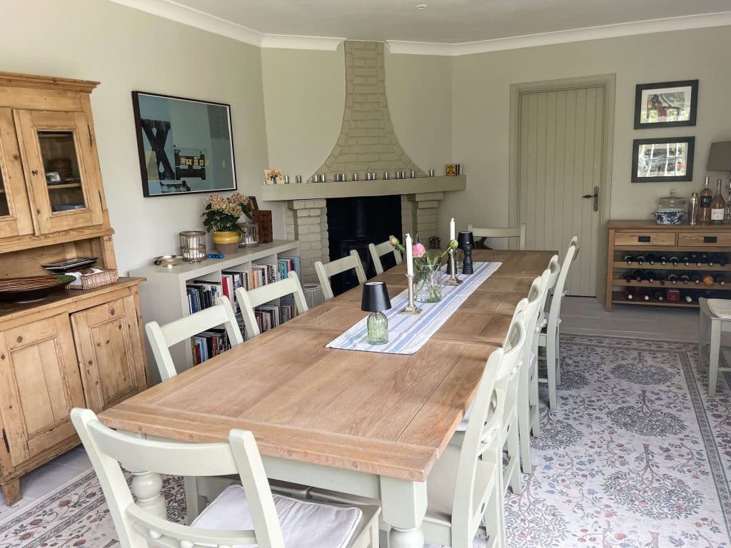 PARK LODGE Dining-room-oak-table-wood-fireplace-cabinet-bookshelve-carpet-wine-rack-TV-filming-location-hire-lodge-London