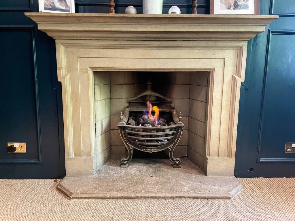 PARK LODGE Fireplace-coal-burn-oak-panel-blue-fireplace-modern-oak-panelling-hearth-TV-filming-location-hire-lodge-London