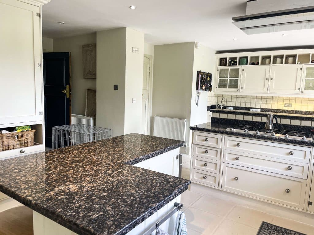 PARK LODGE Kitchen-marble-island-white-tile-floor-cooker-worktops-garden-location-hire-lodge-London