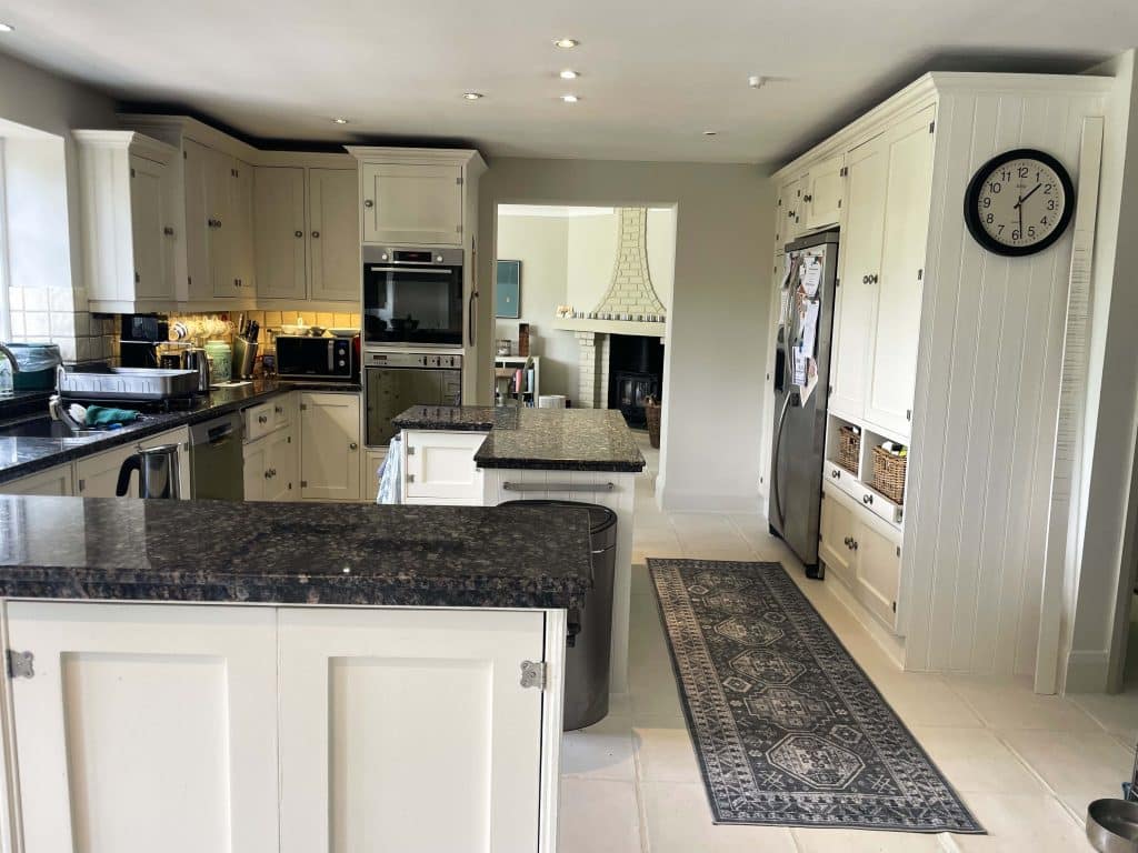 PARK LODGE Kitchen-thru-dining-white-tile-floor-white-cooker-marble-worktops-TV-filming-location-hire-lodge-London