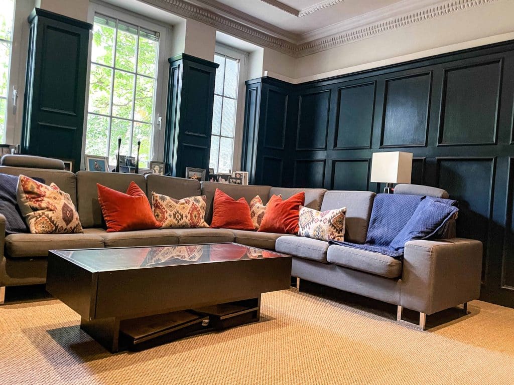 PARK LODGE Lounge-room-sofa-blue-oak-panel-beige-carpet-modern-TV-filming-location-hire-lodge-London